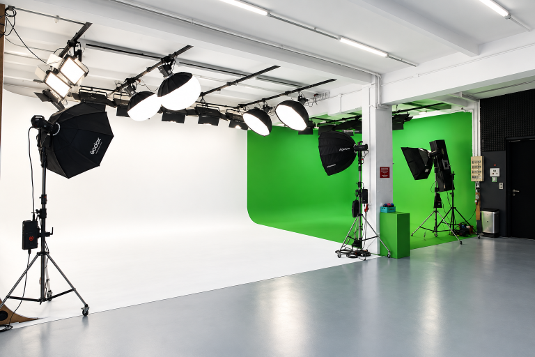 Allmost Studio in Berlin featuring a modern photo studio setup with a white screen and green screen, ideal for high-quality photo and video productions with professional lighting and equipment.